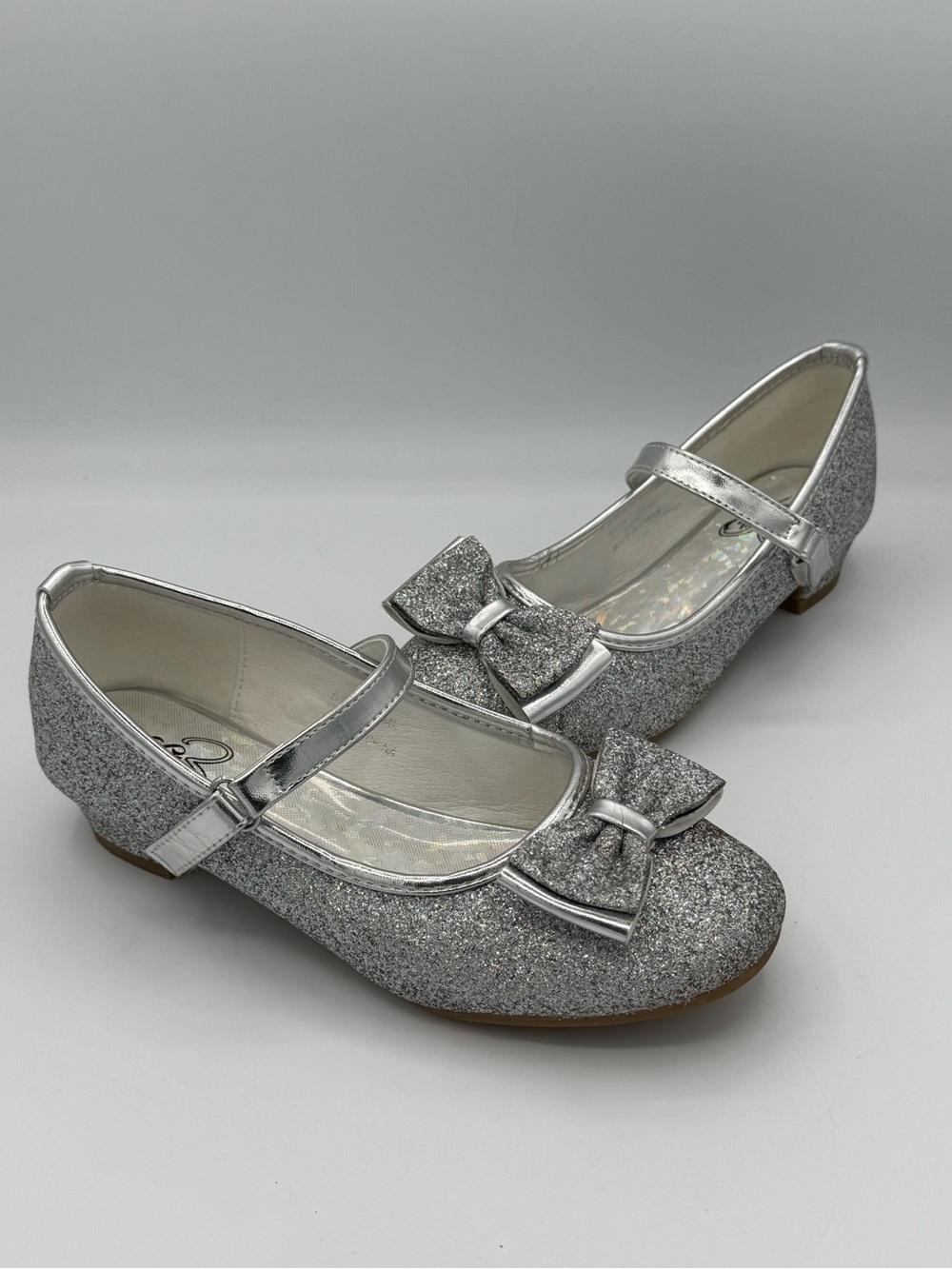 Stelle Mary Jane Silver Glitter Shoes with Prominent Bow